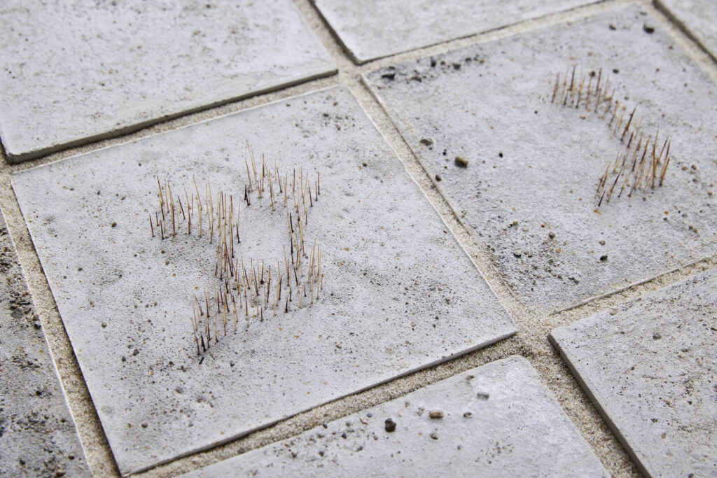 Michal Fuchs, Stable ground #1, 2024, Concrete tiles with Hebrew letters from Cactus drones